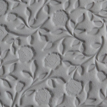 Texture Tile - Roses & Vines sample rolled into gray polymer clay
