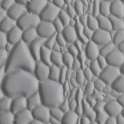 Texture Tile - Reptile Skin Embossed sample rolled into gray polymer clay
