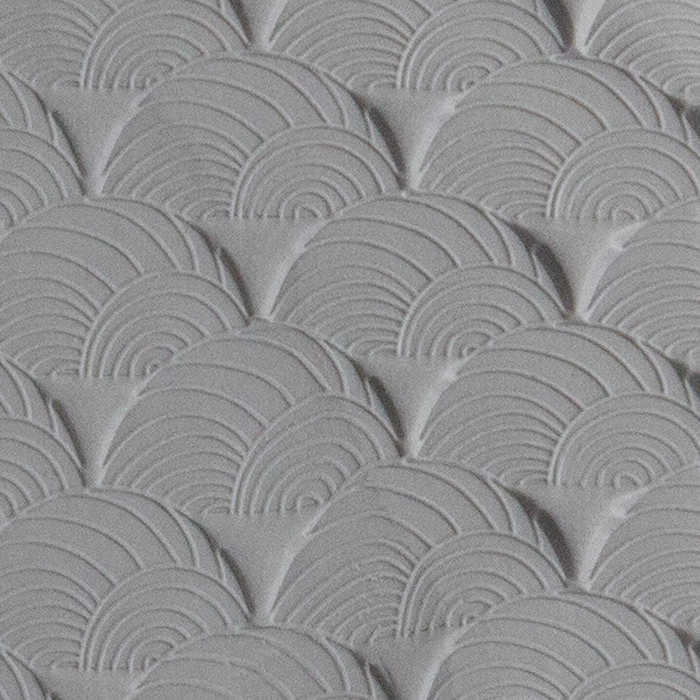 Texture Tile - Seashell Sunset sample rolled into gray polymer clay