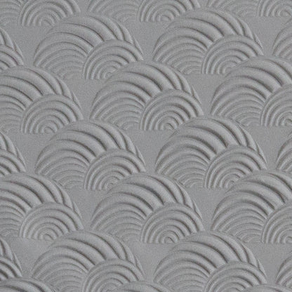 Texture Tile - Seashell Sunset Embossed sample rolled into gray polymer clay