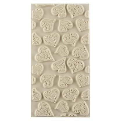 Texture Tile - Heartbreaker. Beige Texture Tiles are flexible, washable and can be used with any soft clay. Spritz with CoolSlip or dust on Dry Powder Release for stick-free impressions when using metal clay and polymer clay.
