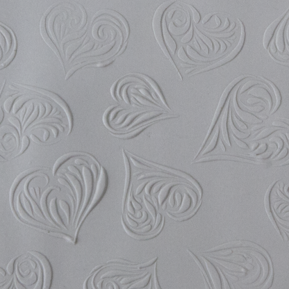 Texture Tile - Heartbreaker Embossed sample rolled into clay