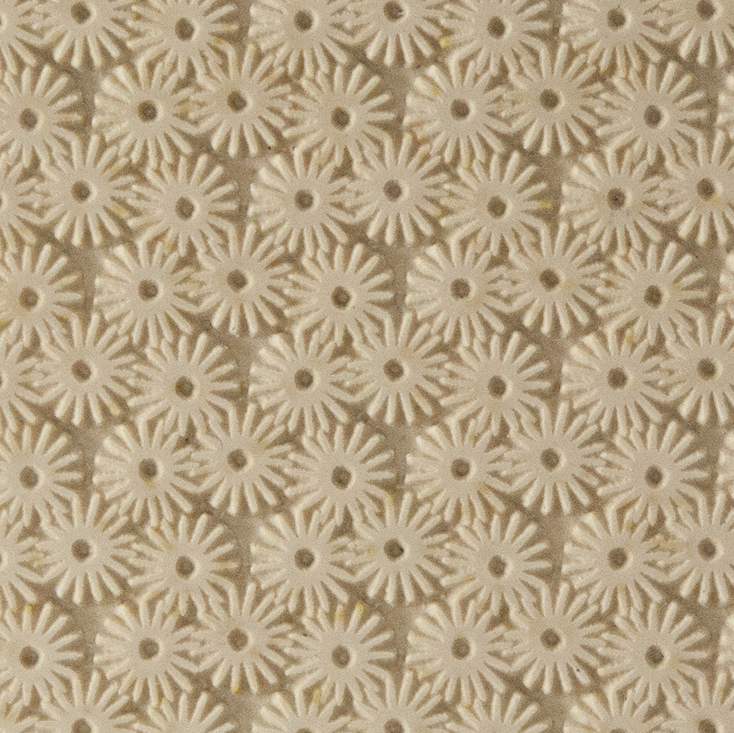 Texture Tile - Starburst. Beige Texture Tiles are flexible, washable and can be used with any soft clay. Spritz with CoolSlip or dust on Dry Powder Release for stick-free impressions when using metal clay and polymer clay.