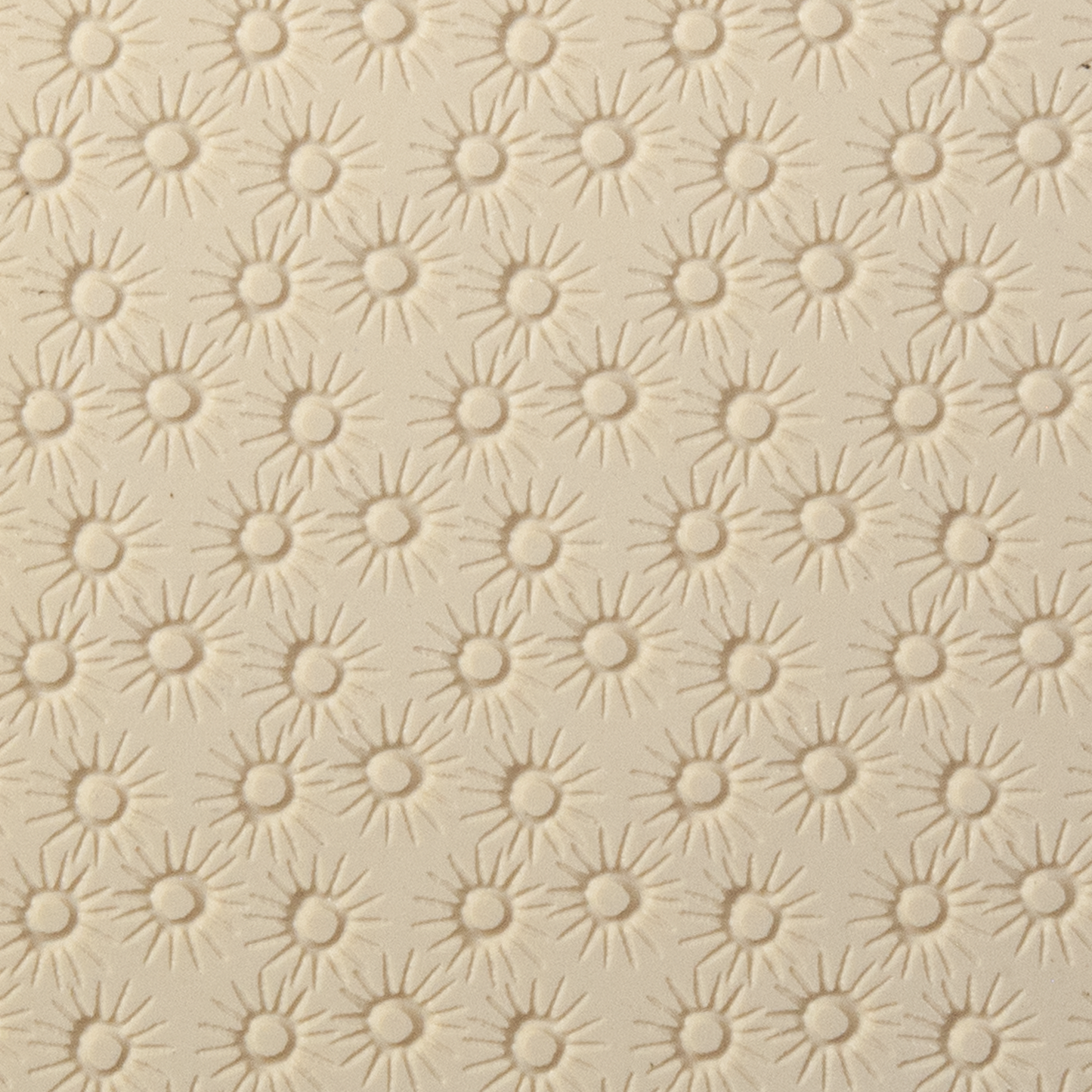 Texture Tile - Starburst Embossed. Beige Texture Tiles are flexible, washable and can be used with any soft clay. Spritz with CoolSlip or dust on Dry Powder Release for stick-free impressions when using metal clay and polymer clay.
