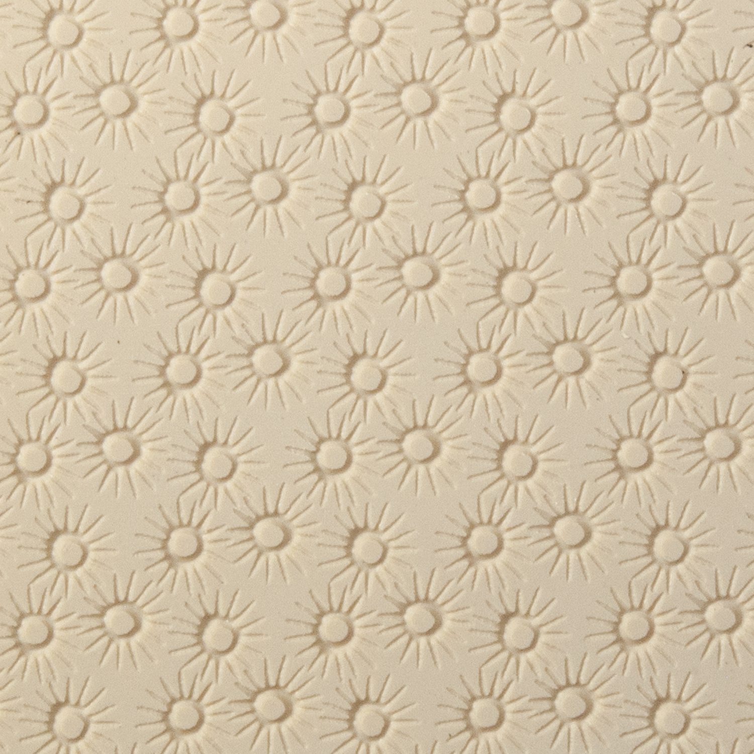 Texture Tile - Starburst Embossed. Beige Texture Tiles are flexible, washable and can be used with any soft clay. Spritz with CoolSlip or dust on Dry Powder Release for stick-free impressions when using metal clay and polymer clay.