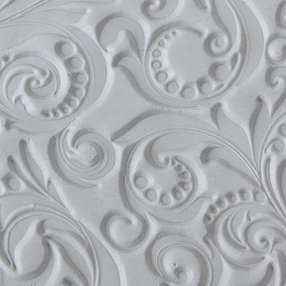 Texture Tile - Leaves and Dots sample rolled into clay