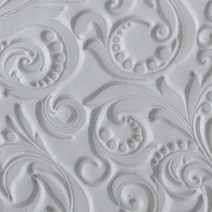 Texture Tile - Leaves and Dots sample rolled into clay