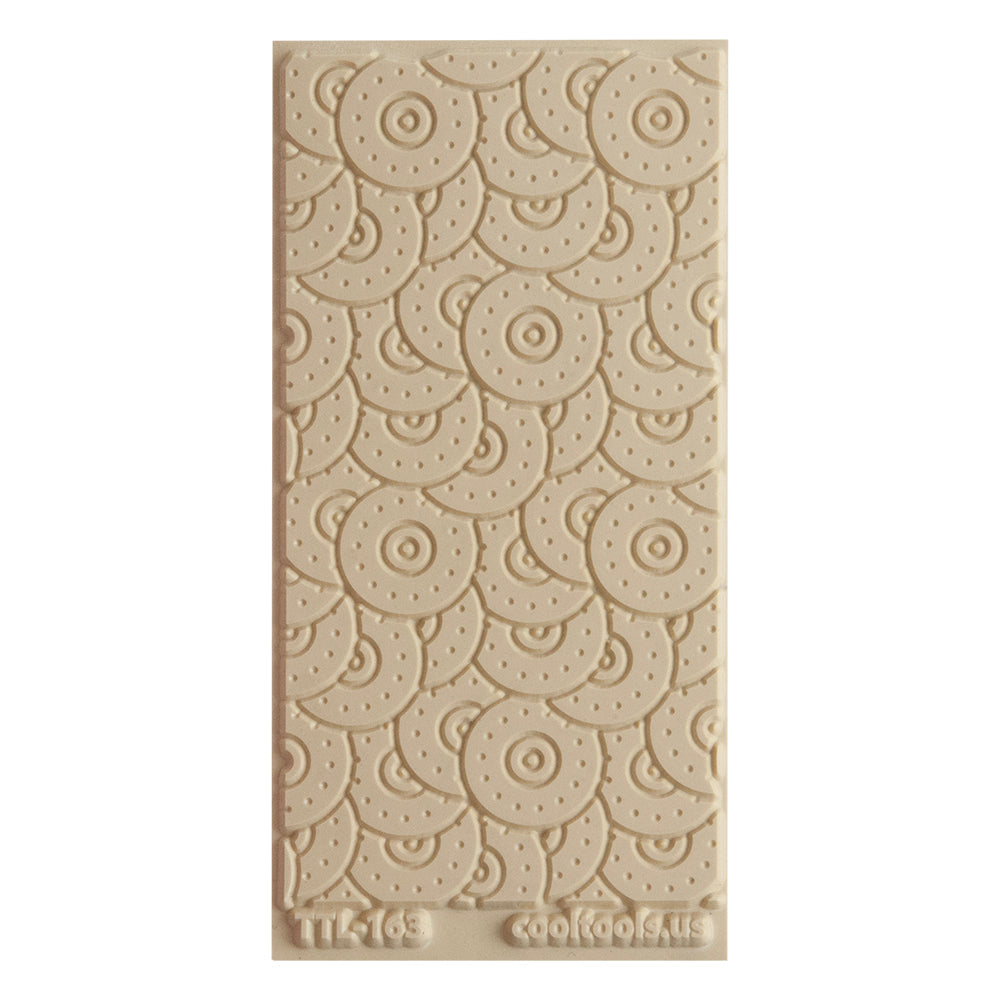 Texture Tile - Random Rivet Embossed. Beige Texture Tiles are flexible, washable and can be used with any soft clay. Spritz with CoolSlip or dust on Dry Powder Release for stick-free impressions when using metal clay and polymer clay.