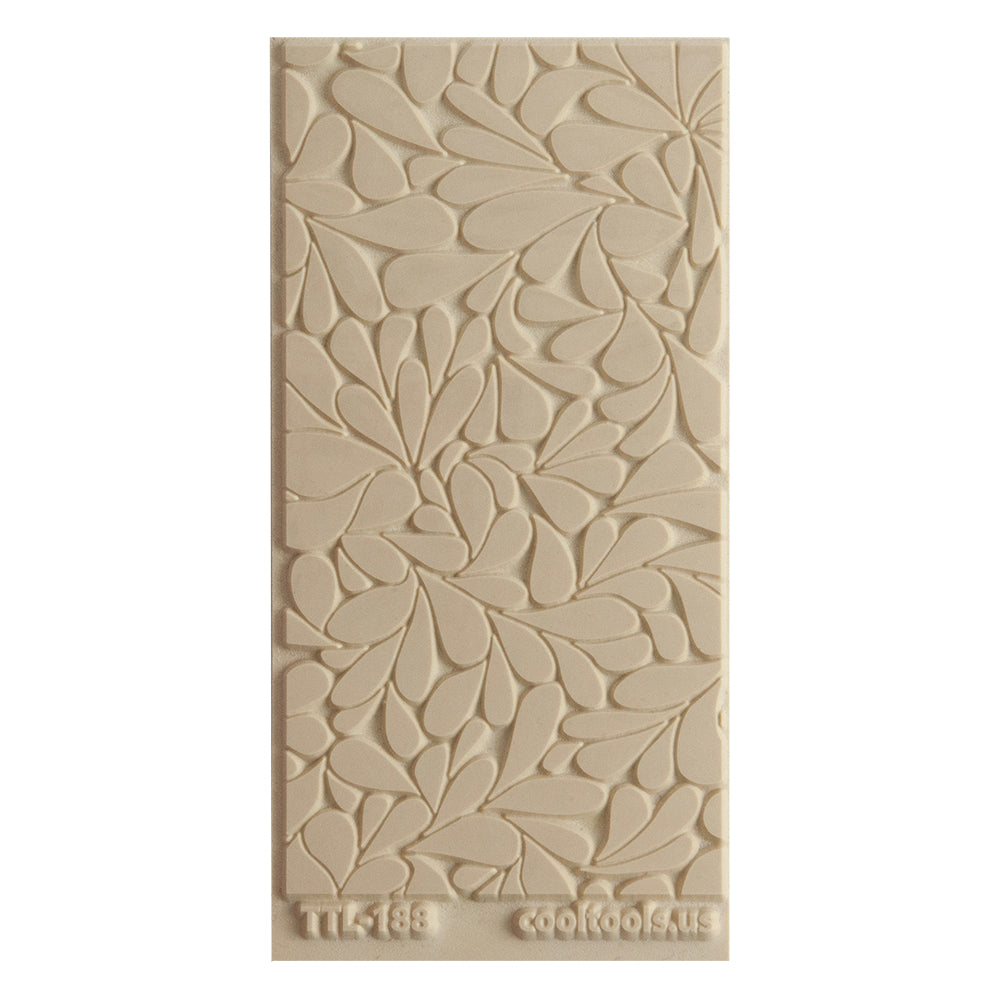 Texture Tile - Fern Gully. Beige Texture Tiles are flexible, washable and can be used with any soft clay. Spritz with CoolSlip or dust on Dry Powder Release for stick-free impressions when using metal clay and polymer clay.