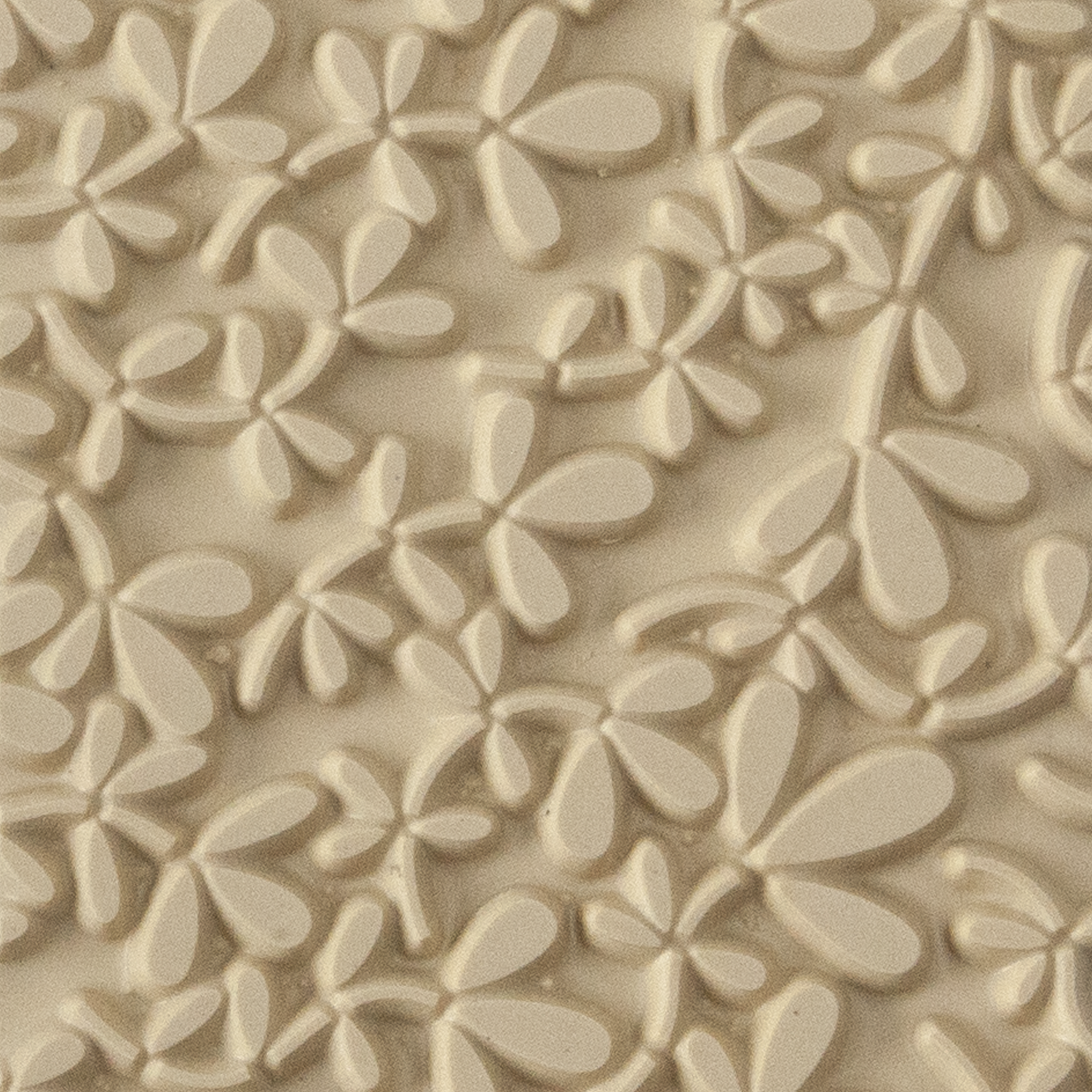 Texture Tile - Leafy Vine. Beige Texture Tiles are flexible, washable and can be used with any soft clay. Spritz with CoolSlip or dust on Dry Powder Release for stick-free impressions when using metal clay and polymer clay.