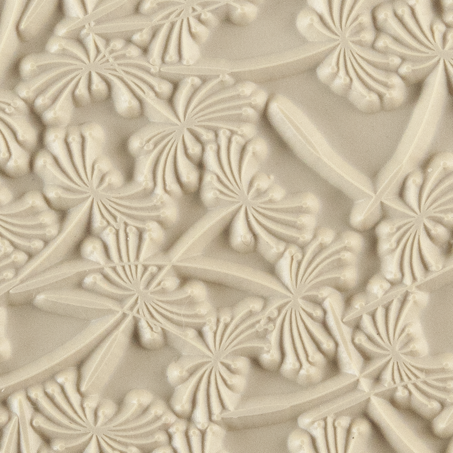 Texture Tile - Dandelion Wish. Beige Texture Tiles are flexible, washable and can be used with any soft clay. Spritz with CoolSlip or dust on Dry Powder Release for stick-free impressions when using metal clay and polymer clay.