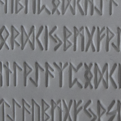 Texture Tile - Cave Writing sample rolled into clay
