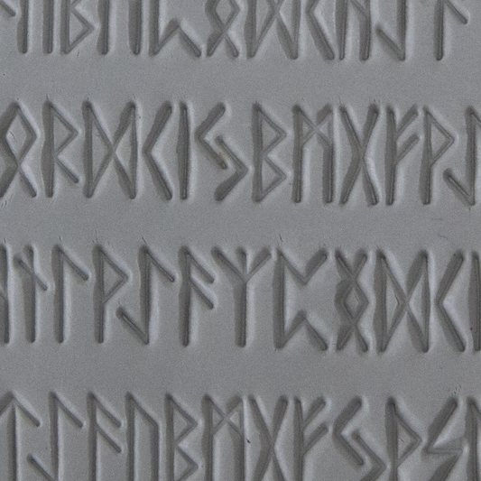 Texture Tile - Cave Writing sample rolled into clay