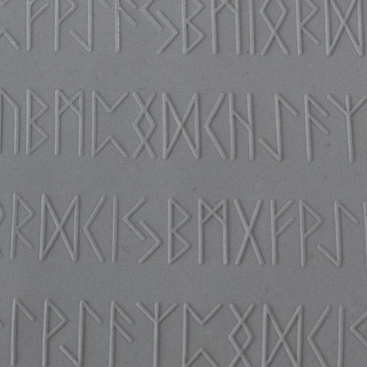 Texture Tile - Cave Writing Embossed sample rolled into clay