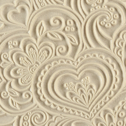 Texture Tile - Blooming Hearts. Beige Texture Tiles are flexible, washable and can be used with any soft clay. Spritz with CoolSlip or dust on Dry Powder Release for stick-free impressions when using metal clay and polymer clay.
