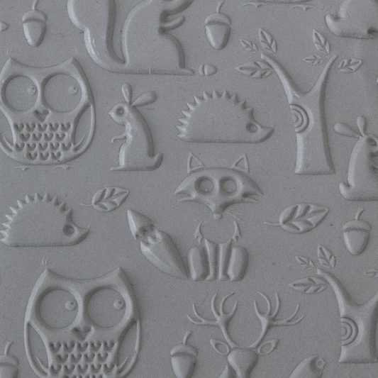 Texture Tile - Woodland Residents Embossed sample rolled into clay