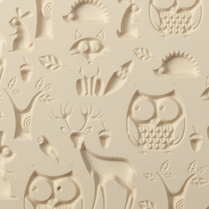 Texture Tile - Woodland Residents Embossed. Beige Texture Tiles are flexible, washable and can be used with any soft clay. Spritz with CoolSlip or dust on Dry Powder Release for stick-free impressions when using metal clay and polymer clay.
