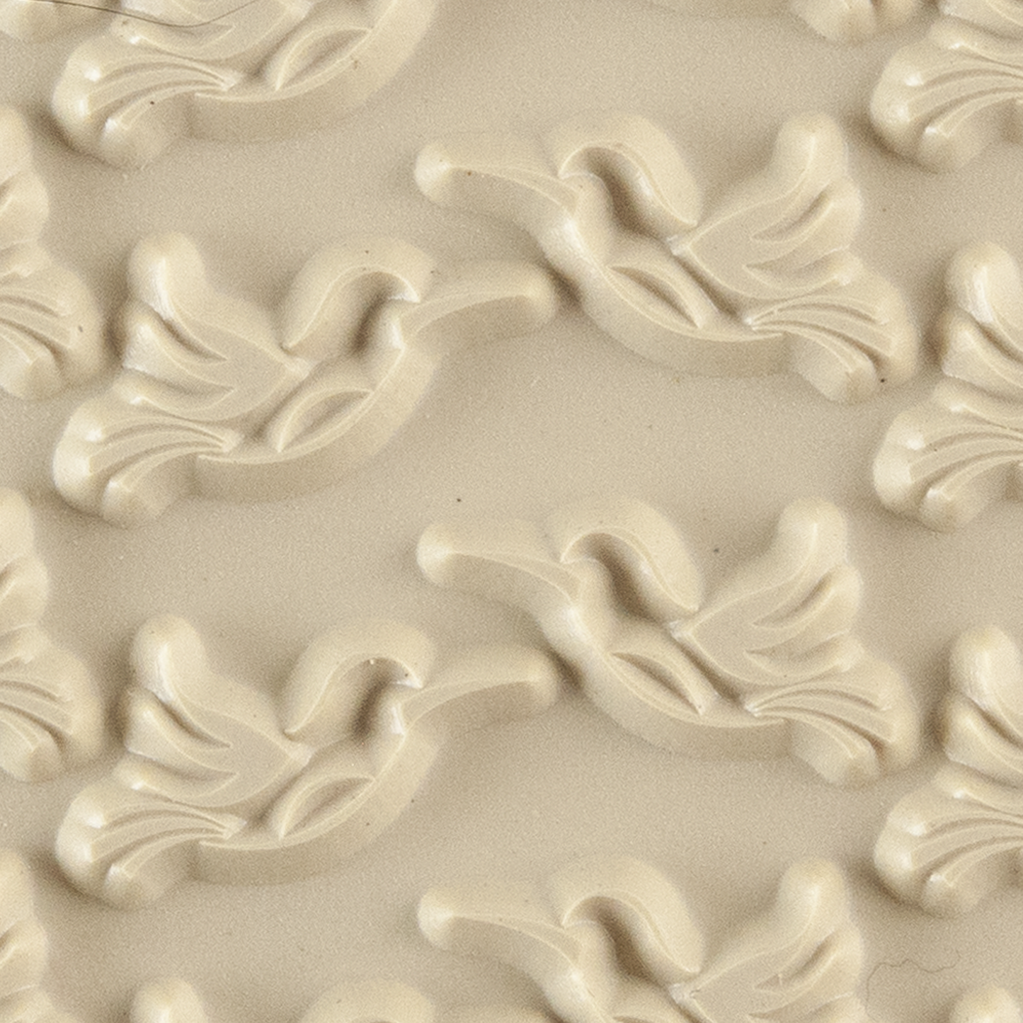 Texture Tile - Humming Around. Beige Texture Tiles are flexible, washable and can be used with any soft clay. Spritz with CoolSlip or dust on Dry Powder Release for stick-free impressions when using metal clay and polymer clay.