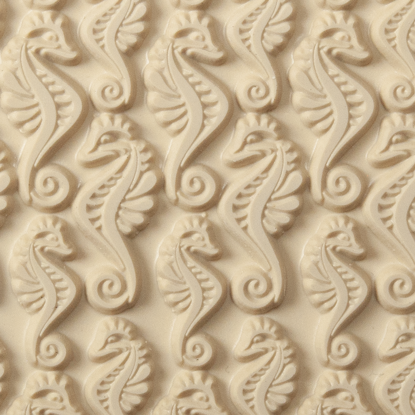 Texture Tile - Dragon of the Sea. Beige Texture Tiles are flexible, washable and can be used with any soft clay. Spritz with CoolSlip or dust on Dry Powder Release for stick-free impressions when using metal clay and polymer clay.