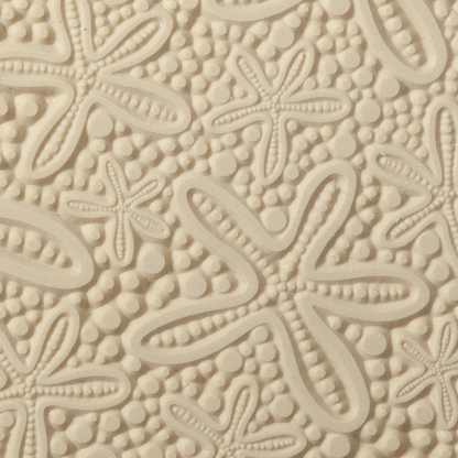 Texture Tile - Cosmic Starfish. Beige Texture Tiles are flexible, washable and can be used with any soft clay. Spritz with CoolSlip or dust on Dry Powder Release for stick-free impressions when using metal clay and polymer clay.