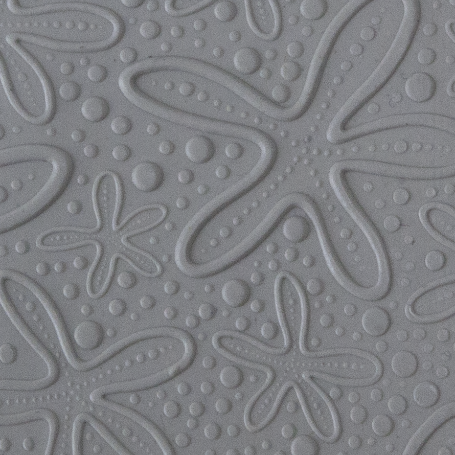 Texture Tile - Cosmic Starfish Embossed sample rolled into clay