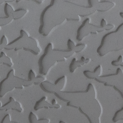 Texture Tile - Flying Dolphins sample rolled into clay