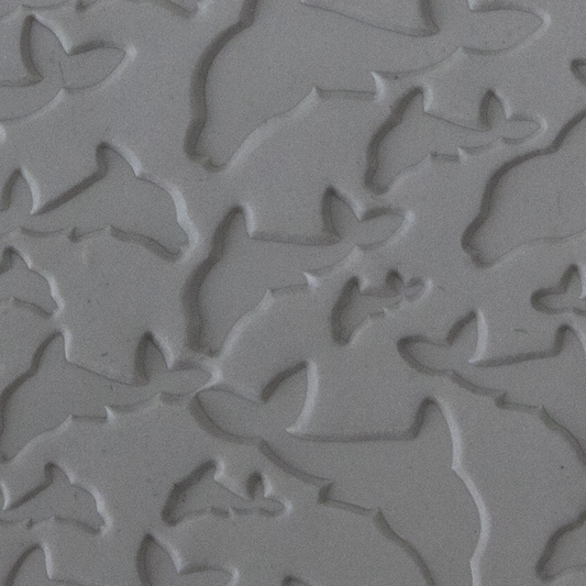 Texture Tile - Flying Dolphins sample rolled into clay