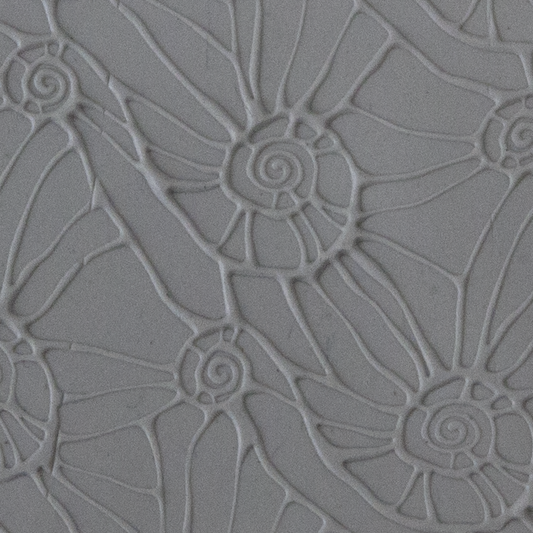 Texture Tile - Snail Parade Embossed sample rolled into clay