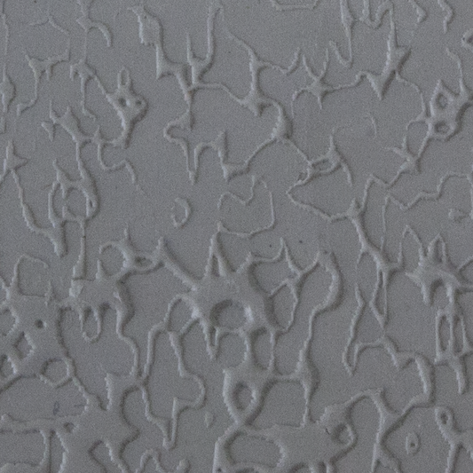 Texture Tile - Dark Water sample rolled into clay