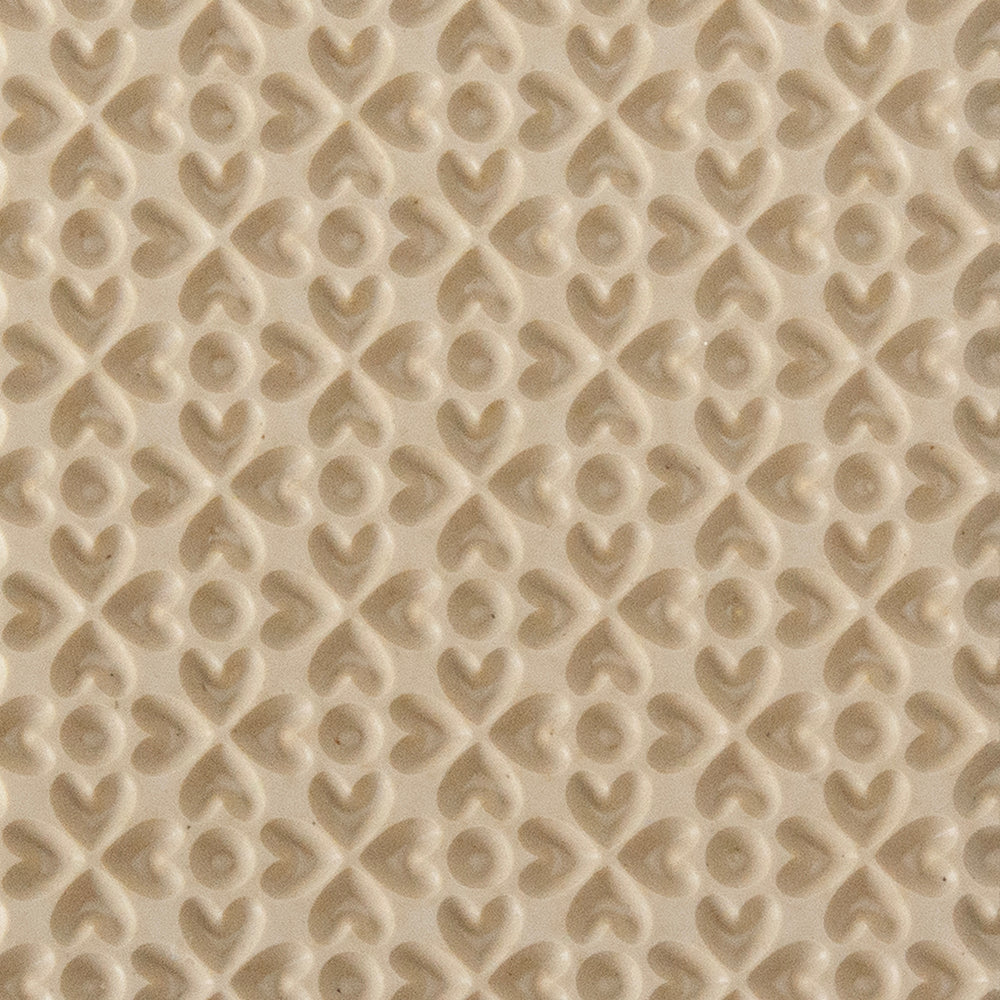 Texture Tile - Lucky Hearts Embossed. Texture Tiles are flexible, washable and can be used with any soft clay. Spritz with CoolSlip or dust on Dry Powder Release for stick-free impressions when using metal clay and polymer clay.