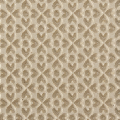 Texture Tile - Lucky Hearts Embossed. Texture Tiles are flexible, washable and can be used with any soft clay. Spritz with CoolSlip or dust on Dry Powder Release for stick-free impressions when using metal clay and polymer clay.