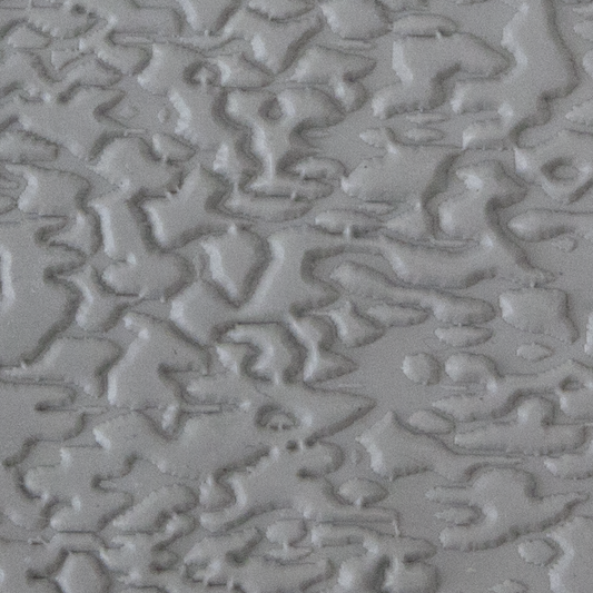Texture Tile - Dark Water Embossed sample rolled into clay