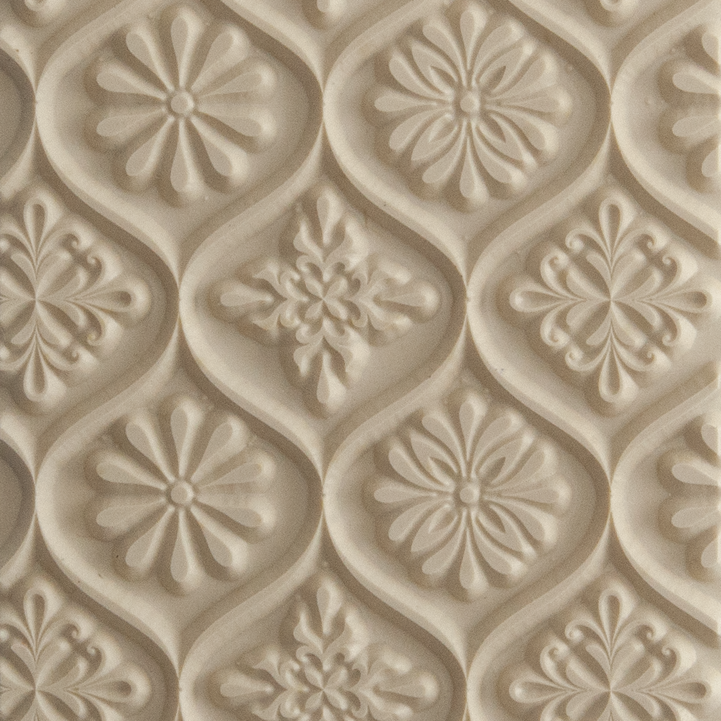 Texture Tile - Woven Daisies. Beige Texture Tiles are flexible, washable and can be used with any soft clay. Spritz with CoolSlip or dust on Dry Powder Release for stick-free impressions when using metal clay and polymer clay.