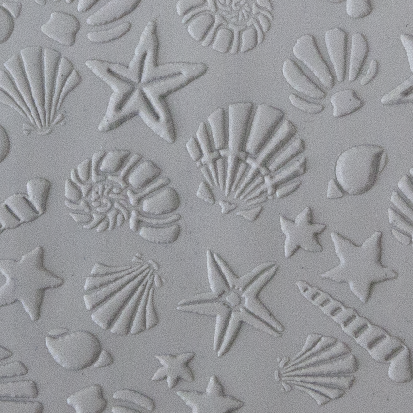 Texture Tile - Seashells sample rolled into clay