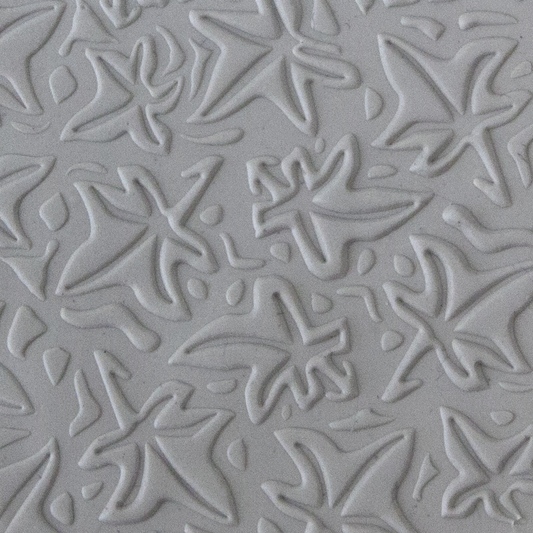 Texture Tile - Woodcut Leaves Embossed sample rolled into clay