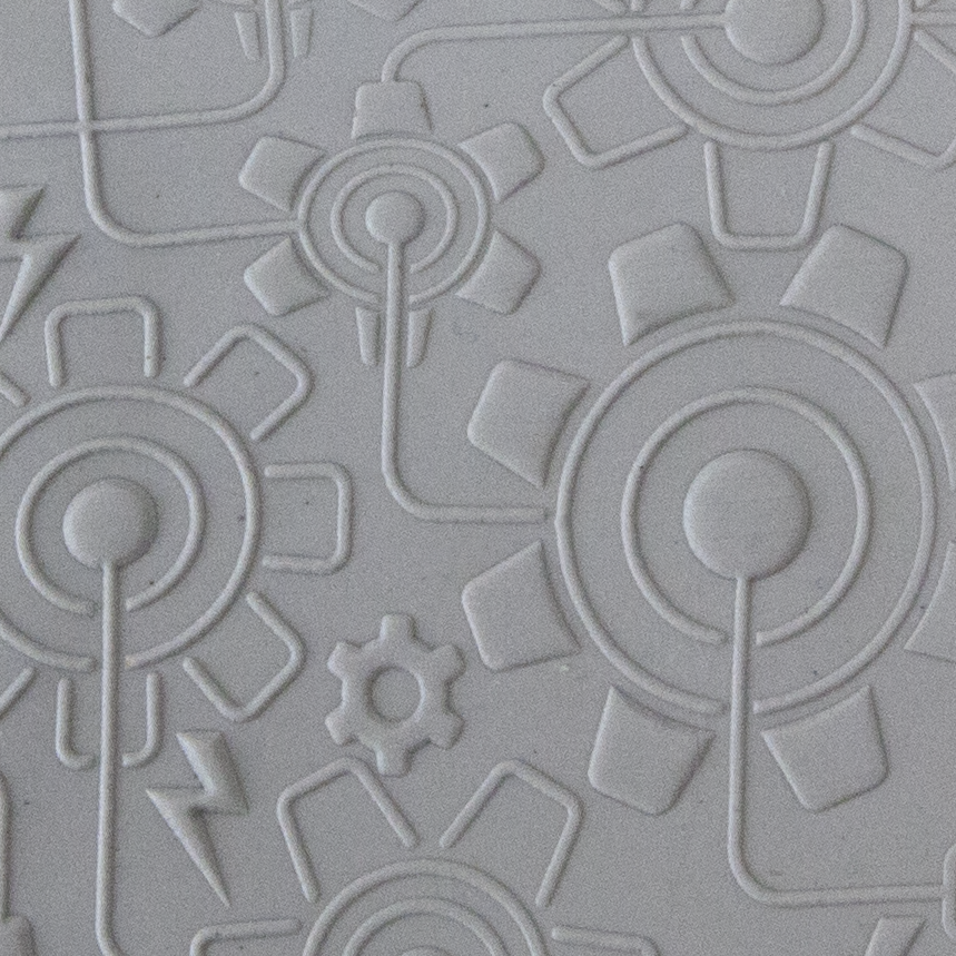 Texture Tile - Electric Gears Embossed sample rolled into clay