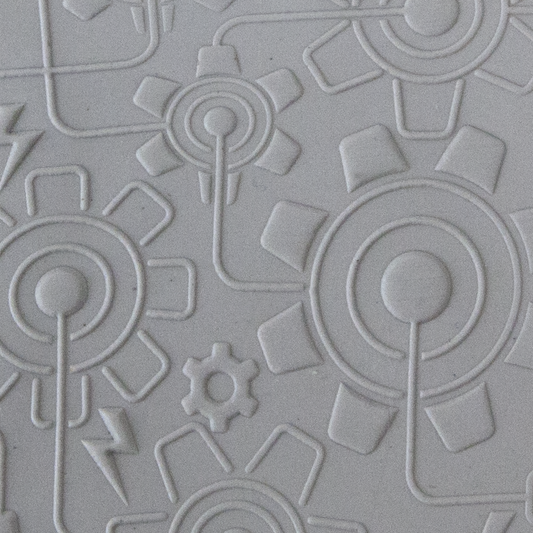 Texture Tile - Electric Gears Embossed sample rolled into clay