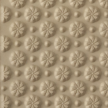 Texture Tile - Field of Daisies. Beige Texture Tiles are flexible, washable and can be used with any soft clay. Spritz with CoolSlip or dust on Dry Powder Release for stick-free impressions when using metal clay and polymer clay.