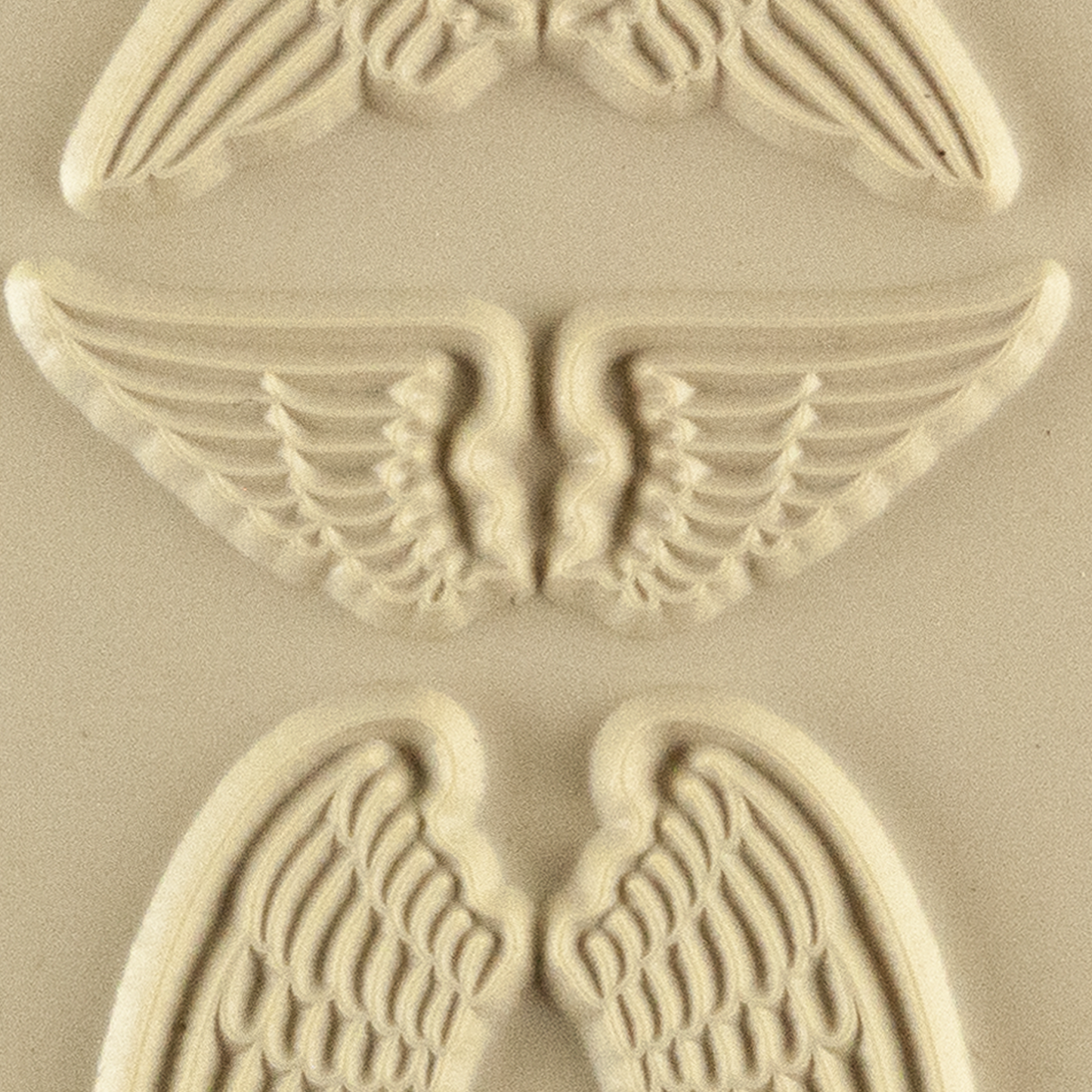 Texture Tile - Natural Wings. Beige Texture Tiles are flexible, washable and can be used with any soft clay. Spritz with CoolSlip or dust on Dry Powder Release for stick-free impressions when using metal clay and polymer clay.