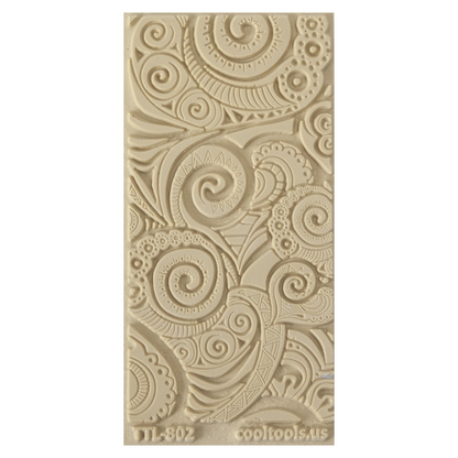 Texture Tile - Swirly Hearts Embossed. Beige Texture Tiles are flexible, washable and can be used with any soft clay. Spritz with CoolSlip or dust on Dry Powder Release for stick-free impressions when using metal clay and polymer clay.
