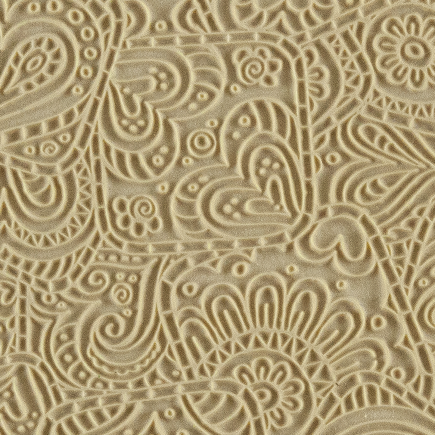 Texture Tile - Doodling Hearts. Beige Texture Tiles are flexible, washable and can be used with any soft clay. Spritz with CoolSlip or dust on Dry Powder Release for stick-free impressions when using metal clay and polymer clay.