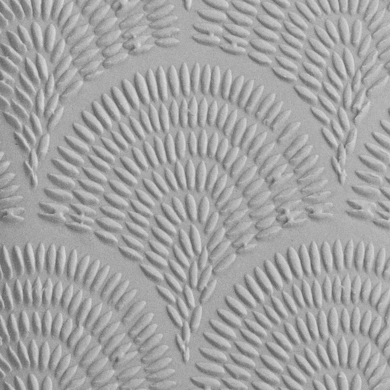 Texture Tile - Abstract Sunrise Embossed sample rolled into clay