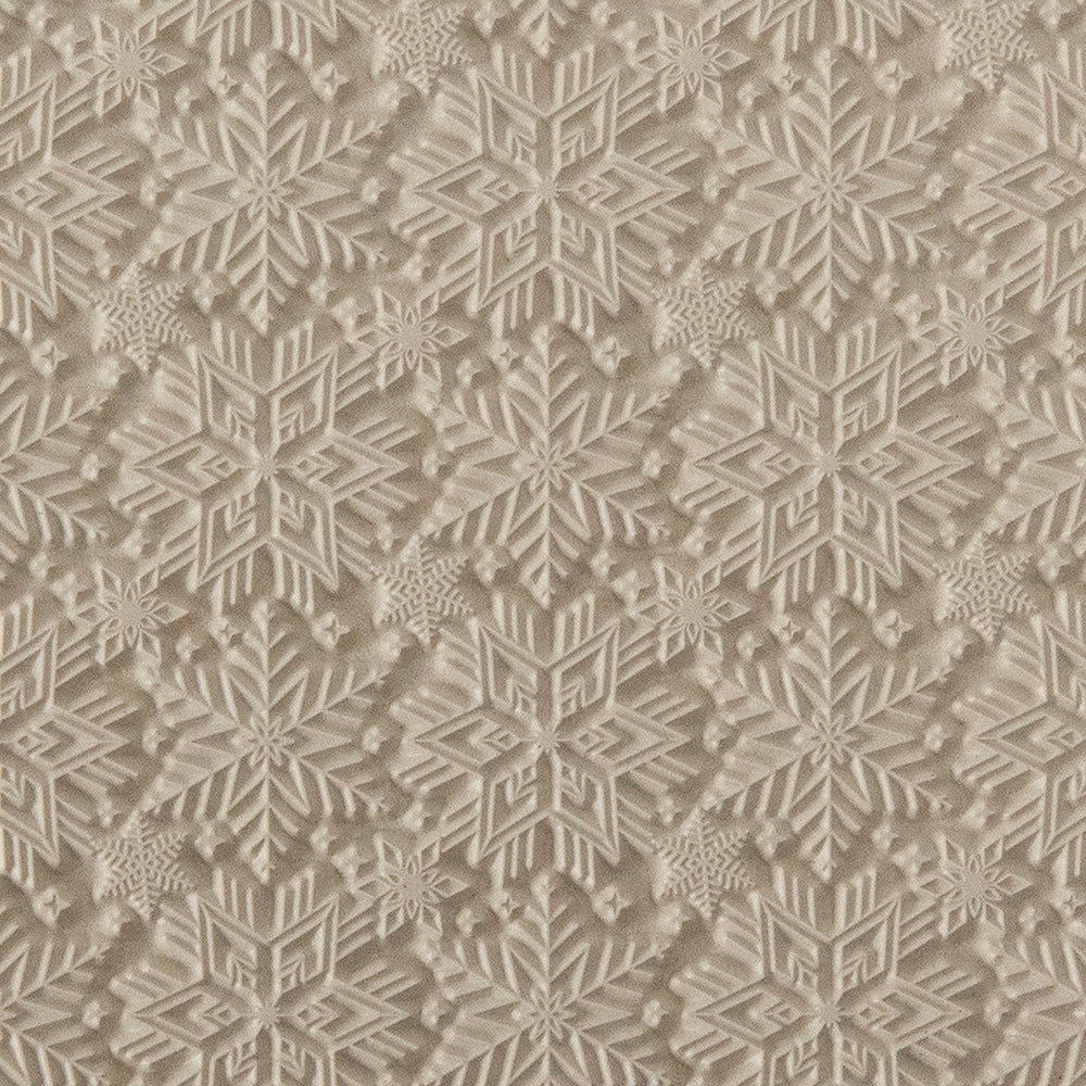 Texture Tile - Snowflakes. Beige Texture Tiles are flexible, washable and can be used with any soft clay. Spritz with CoolSlip or dust on Dry Powder Release for stick-free impressions when using metal clay and polymer clay.