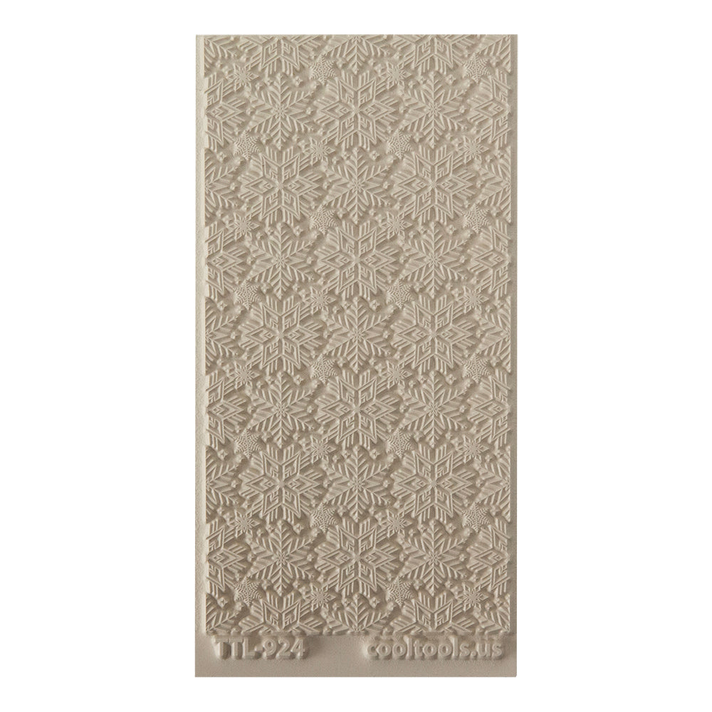 Texture Tile - Snowflakes. Beige Texture Tiles are flexible, washable and can be used with any soft clay. Spritz with CoolSlip or dust on Dry Powder Release for stick-free impressions when using metal clay and polymer clay.