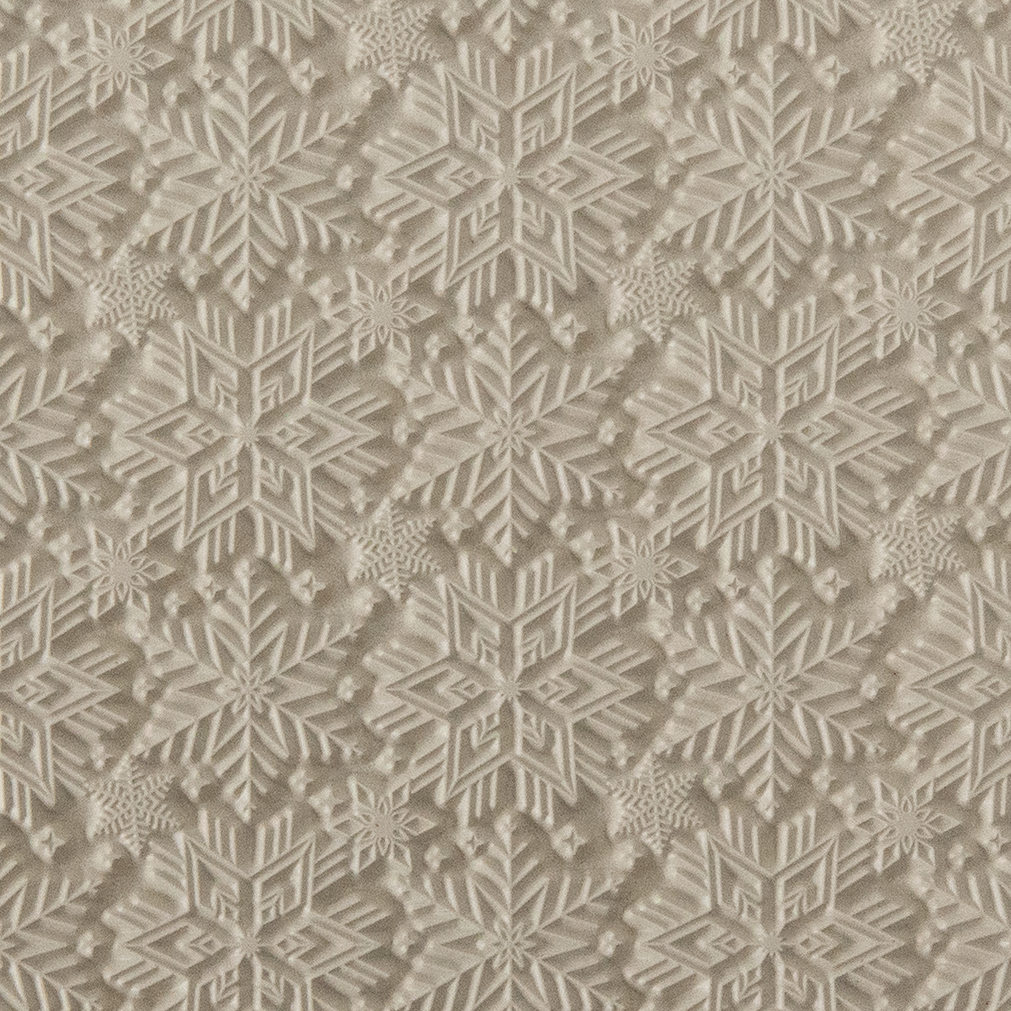 Texture Tile - Snowflakes. Beige Texture Tiles are flexible, washable and can be used with any soft clay. Spritz with CoolSlip or dust on Dry Powder Release for stick-free impressions when using metal clay and polymer clay.