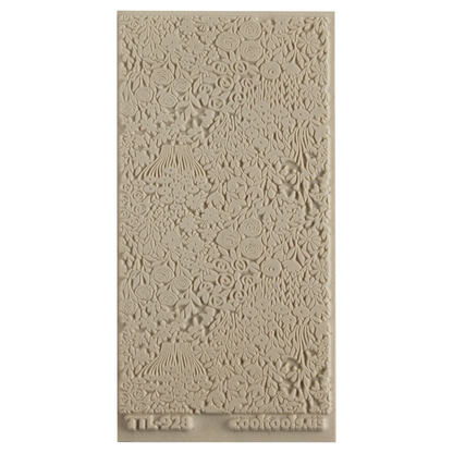 Texture Tile - Field of Flowers. Beige Texture Tiles are flexible, washable and can be used with any soft clay. Spritz with CoolSlip or dust on Dry Powder Release for stick-free impressions when using metal clay and polymer clay.