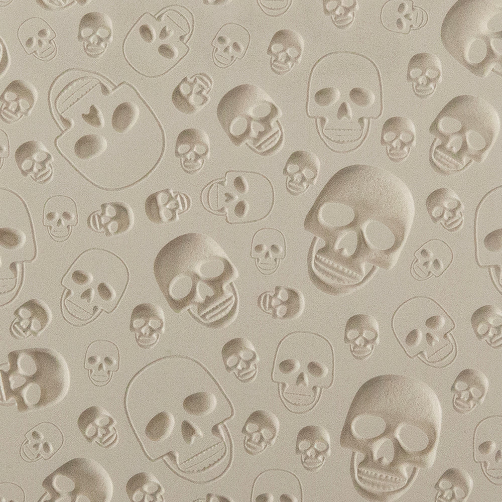 Texture Tile - Skulls Embossed. Beige Texture Tiles are flexible, washable and can be used with any soft clay. Spritz with CoolSlip or dust on Dry Powder Release for stick-free impressions when using metal clay and polymer clay.