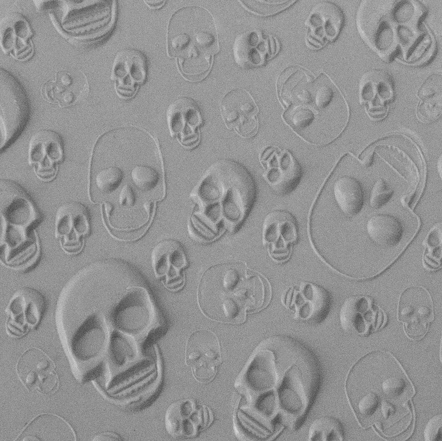 Texture Tile - Skulls Embossed sample rolled into clay