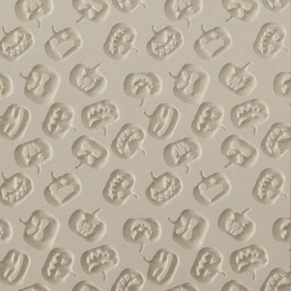 Texture Tile - Carved Pumpkins Embossed. Beige Texture Tiles are flexible, washable and can be used with any soft clay. Spritz with CoolSlip or dust on Dry Powder Release for stick-free impressions when using metal clay and polymer clay.