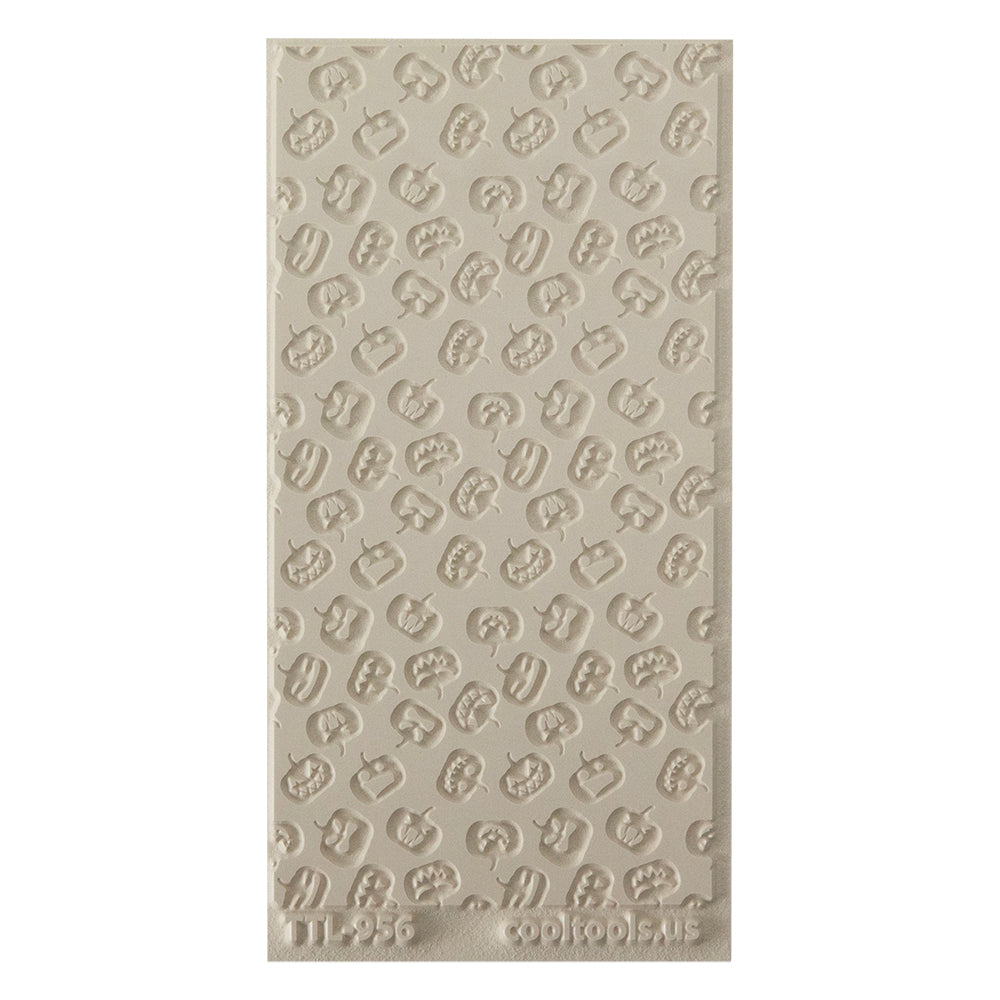 Texture Tile - Carved Pumpkins Embossed. Beige Texture Tiles are flexible, washable and can be used with any soft clay. Spritz with CoolSlip or dust on Dry Powder Release for stick-free impressions when using metal clay and polymer clay.